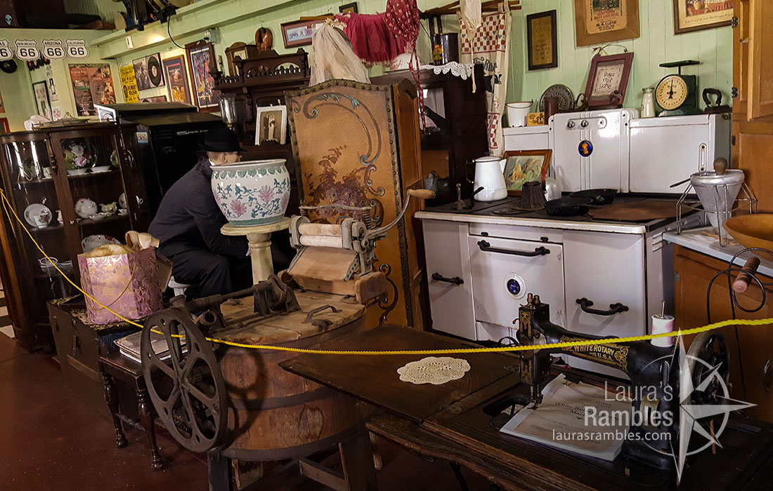 Antiques set up like an apartment - complete with mannequin.